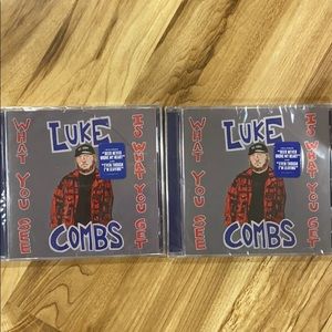 Pair of Luke combs what you see cds